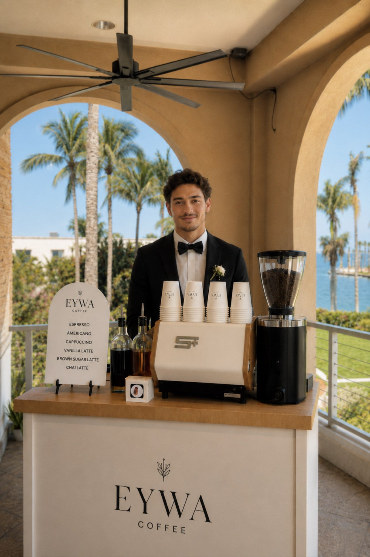 Bar à café mobile EYWA installé pour une réception, barista en tenue